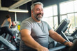 © MVProductions - Full-figured caucasian middle-aged man exercising in gym