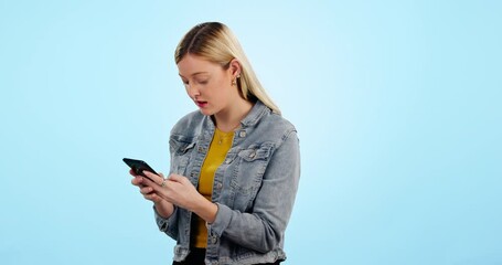 Canvas Print - Frustrated, woman and phone with stress for communication, online chat or internet glitch in studio on blue background. Angry, person and smartphone with argument on text or message and conflict