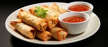 Crispy Spring Rolls And Spicy Sauce On A Plate