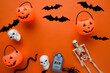 Assorted halloween items. Toys, jack-o-lantern buckets, skeletons, skulls, spiders, bats an snakes