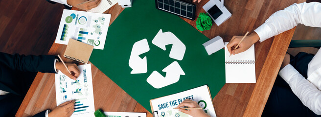 Top view business people planning and discussing on recycle reduce reuse policy symbol in office meeting room. Green business company with eco-friendly waste management regulation concept.Trailblazing