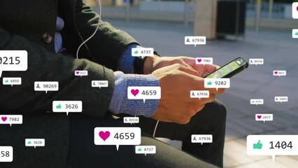 Poster - animation of social media icons against mid section of businessman using smartphone on the street