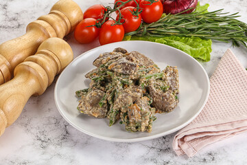 Fried turkey liver with herbs in cream sauce