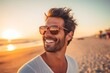© boxstock production - Portrait of Handsome happy man wearing sunglasses on beautiful beach at sunset