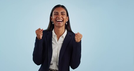 Wall Mural - Business woman, fist celebration and studio with smile, goals and success with face by blue background. Trader, entrepreneur and winner with cheers for finance, profit or increase for stock revenue