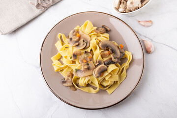 Wall Mural - Fettuccine With Mushrooms. Typical dish of the Italian tradition, suitable for those who follow a vegetarian diet.