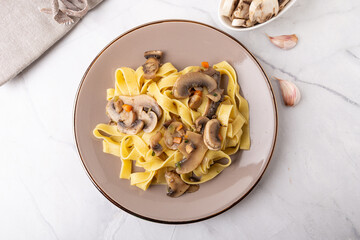 Wall Mural - Fettuccine With Mushrooms. Typical dish of the Italian tradition, suitable for those who follow a vegetarian diet.