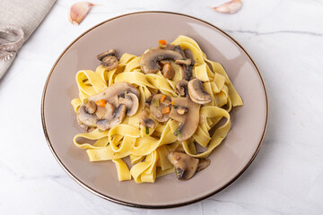 Wall Mural - Fettuccine With Mushrooms. Typical dish of the Italian tradition, suitable for those who follow a vegetarian diet.