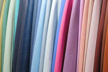 Poster - Mix colorful hanging vertical stripe leather on the rack. Texture of multicolored leather close up.
