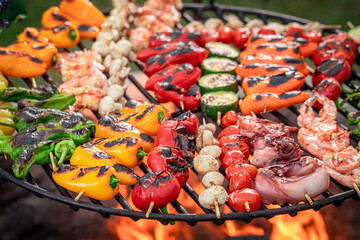 Wall Mural - Healthy and tasty grilled shashlik on grill grate with fire.