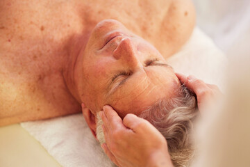 Canvas Print - Spa, head massage and senior man for luxury, self care and muscle healing treatment for relaxation. Health, wellness and elderly male person on a retirement retreat for face therapy at natural salon.