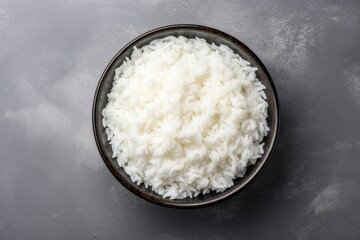 Poster - Top view of grey table with a bowl of boiled rice space for text