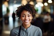 © Baba Images - Smiling portrait of a happe female african american bartender