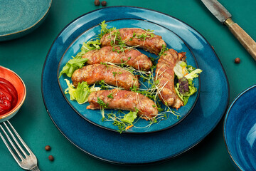 Canvas Print - Plate of fried sausages with herbs