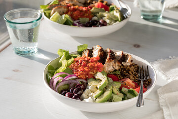 Wall Mural - A healthy mediterranean bowl topped with roasted red pepper sauce.