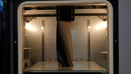 Wall Mural - Printing mechanism is adding layers to ae 3D object. Media. Printer working at 3d printing lab.