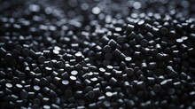 Close Up 3D Illustration Of Black Plastic Pellets A Type Of Polymer Resin