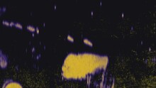 A Black Background With Yellow Droplets Spreading From The Center. The Image Suggests Movement And Dispersion, Creating A Visually Striking Effect