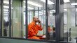Generative AI, arrested man in an orange suit talking on the phone in prison, prisoner in the visiting room, jail, bars, solitary confinement, law, criminal, crime, accusation