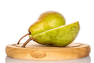 Wall Mural - One half of a ripe pear and one whole on a wooden tray, macro, isolated on white background.