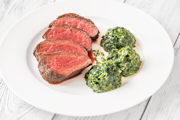 Wall Mural - Flank steak with creamy spinach