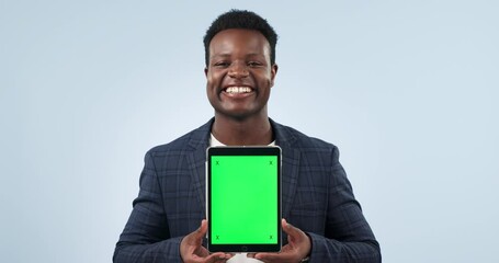 Poster - Happy black man, tablet and green screen in advertising or marketing against a studio background. Portrait of African businessman smile showing technology display, app or mockup with tracking markers