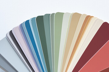 Poster - paint-chip sample book with analogous color scheme on blank paper