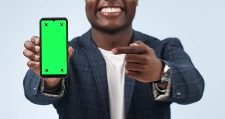 Poster - Happy man, phone and pointing to green screen in advertising or marketing against a studio background. Closeup of businessman showing mobile smartphone app, display or mockup with tracking markers