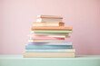 © barmaleeva - Stack of books in soft pastel colors. Generative AI