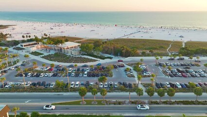 Wall Mural - Aerial view of parking lot for tourists cars in front of famous Siesta Key beach in Sarasota, USA. Popular vacation spot in warm Florida at sunset