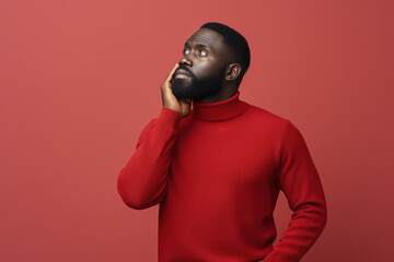 Poster - A man wearing a red turtle neck sweater is seen talking on a cell phone. This image can be used to illustrate communication, technology, or modern lifestyle concepts.