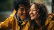 © JKLoma - young asian couple with yellow raincoat having fun to play with the rain in the evening.