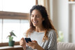 © fizkes - Overjoyed millennial girl hold modern cellphone gadget feel euphoric win online lottery, excited young woman laugh triumph reading good news on smartphone, luck, new technology concept