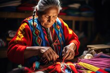 A Skilled Peruvian Sewing Artisan, An Elderly Woman, Works On A Vibrant Fabric Creation.