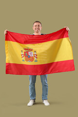 Poster - Mature man with flag of Spain on green background