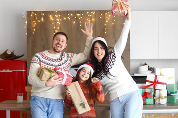 Sticker - Happy family with Christmas presents in kitchen