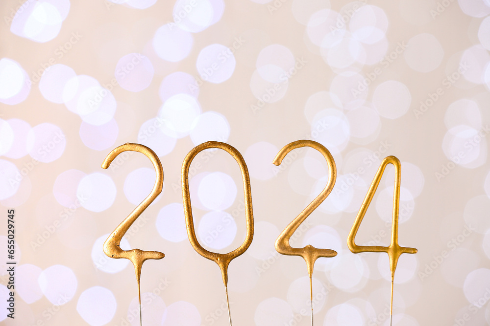 Golden figure 2024 against blurred lights