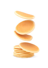 Wall Mural - Many tasty fresh pancakes falling on white background