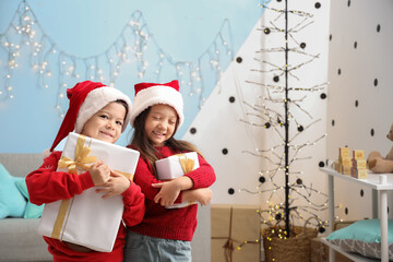 Poster - Adorable little children with Christmas gifts at home