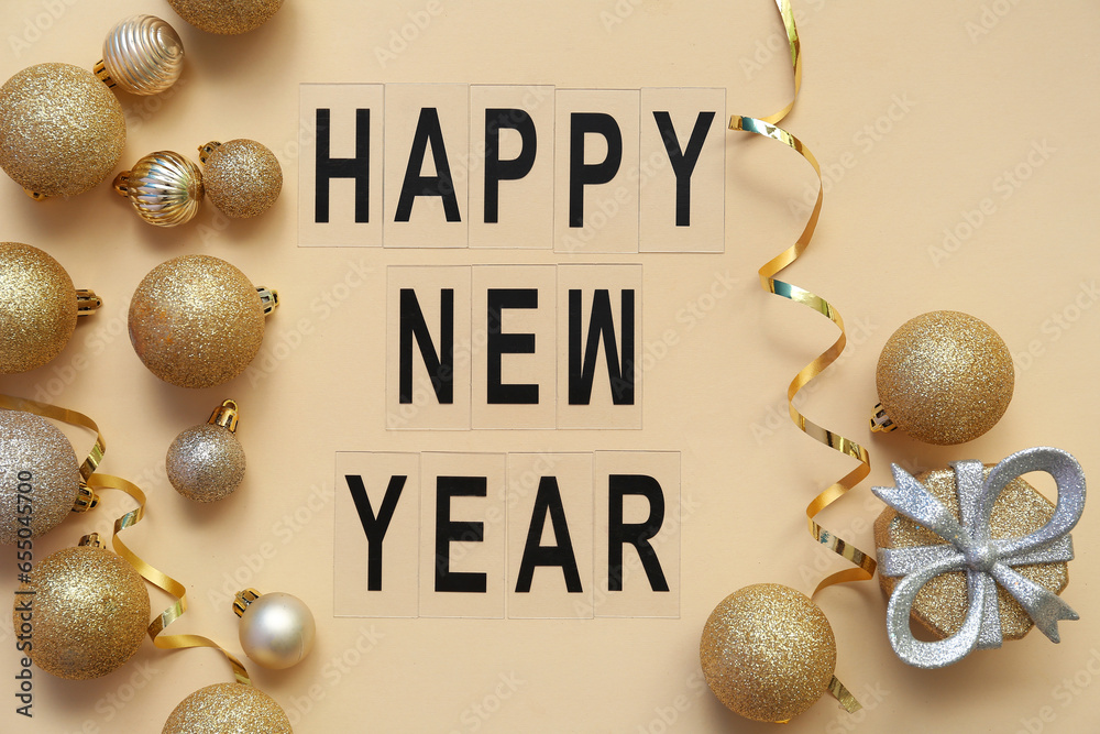 Text HAPPY NEW YEAR with Christmas balls and gift box on yellow background