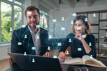 Wall Mural - thoughtful businesspeople typing on laptop at office workplace. concept of team work, business educa