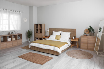 Poster - Interior of stylish bedroom with tables, drawers and shelf unit