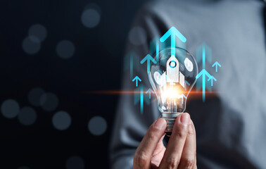 Aufkleber - Business growth journey of a rocket launch inside light bulb, Arrow accelerate towards to goals, rapid startup momentum. sights are set on achieving success, forward with determination and innovation.