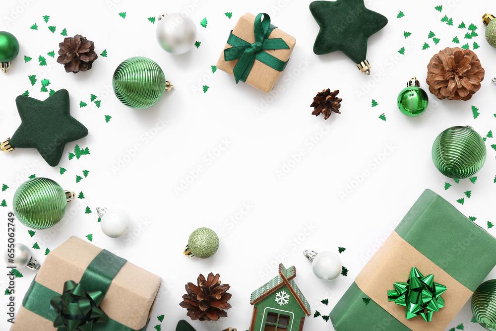 Frame made of beautiful Christmas decorations and gift boxes on white background