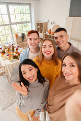 Sticker - Group of young friends taking selfie on Thanksgiving Day