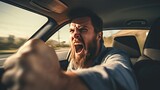 Fototapeta  - Close-up of an angry male driver yelling at other drivers.