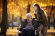 © AspctStyle - Happy daughter pushing senior man in wheelchair outdoor in autumn park
