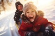 happy girl and a boy are sliding down a slide in a snowy forest. New year and Christmas Festive Atmosphere concept.