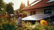 A young child is looking at solar panels in the yard
