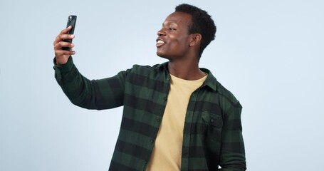 Poster - smile, black man and smartphone with wave, hello and communication on a blue studio background. afri